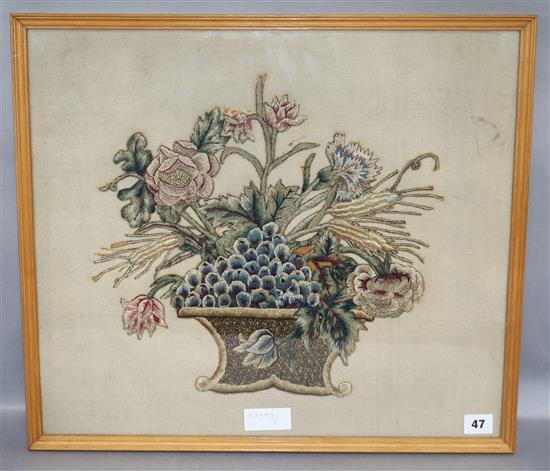 A framed 18th century needlework motif basket of fruit and flowers